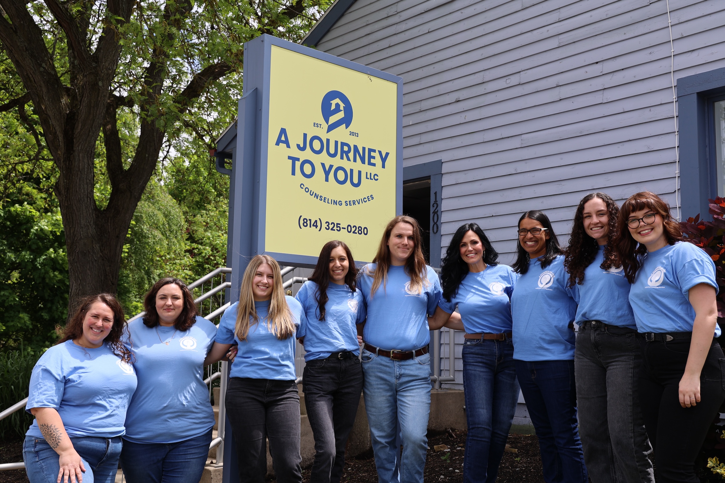 A Journey to You team picture outside counseling service building